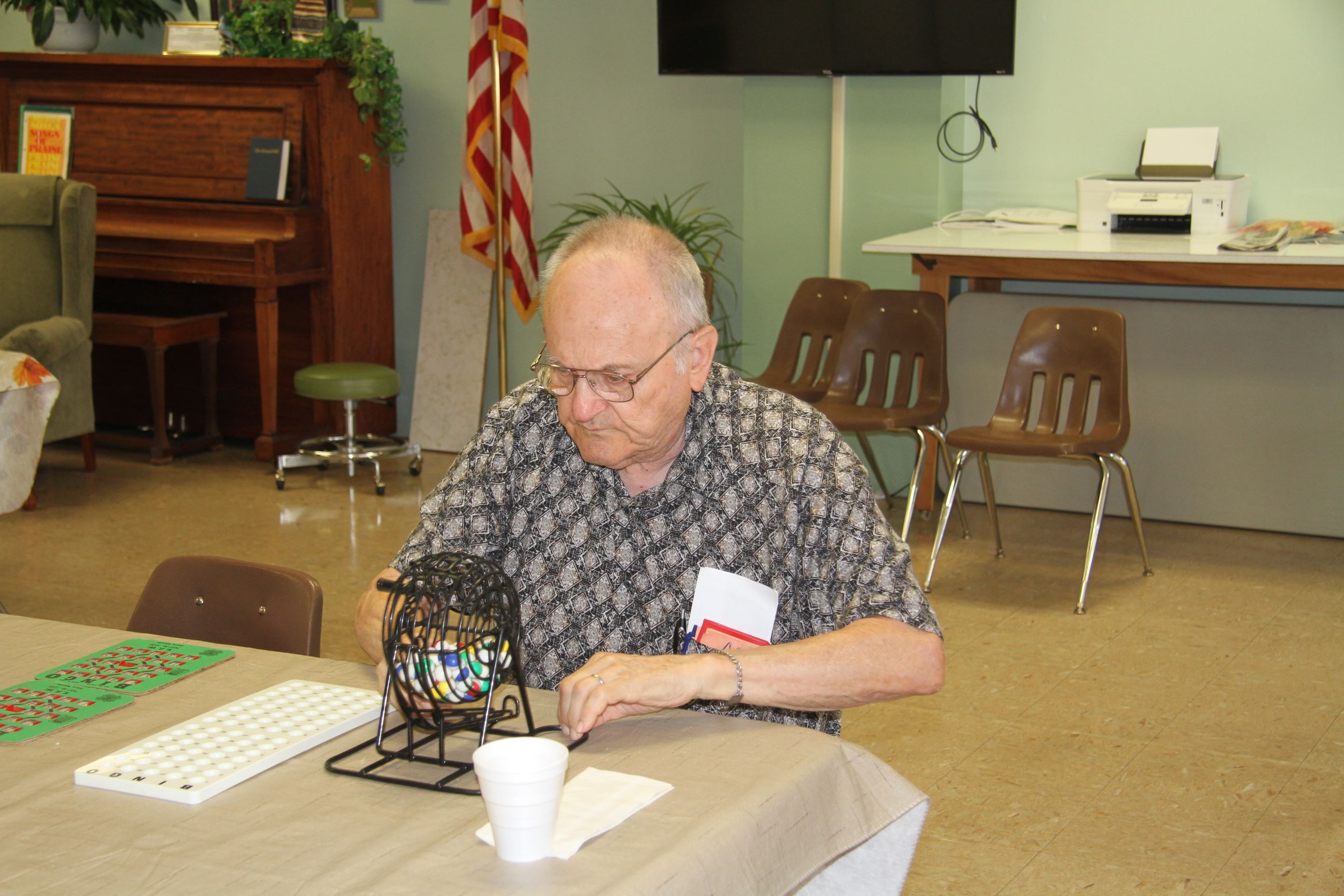 Man Calling Out Numbers for Bingo