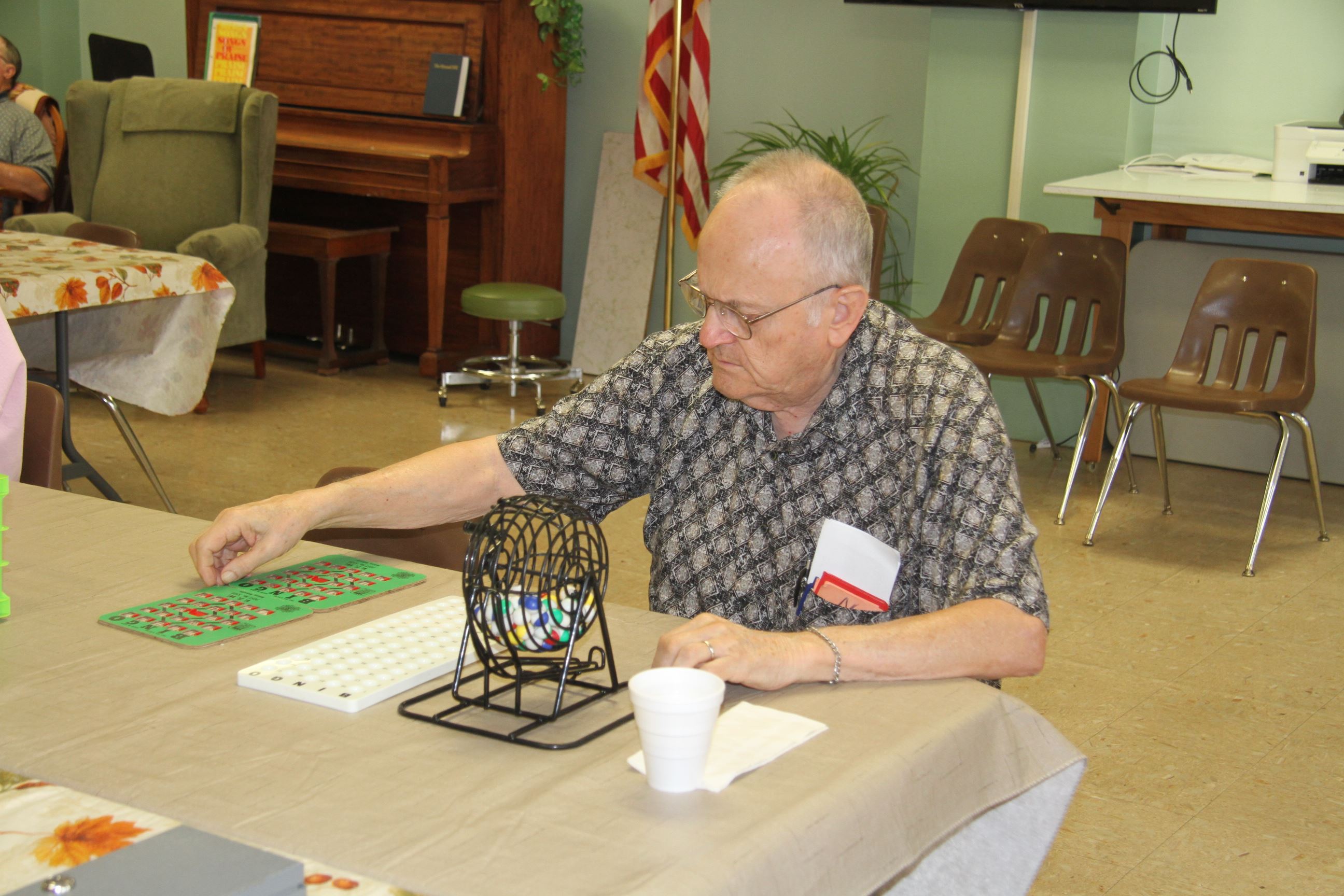 Man Calling Out Numbers for Bingo