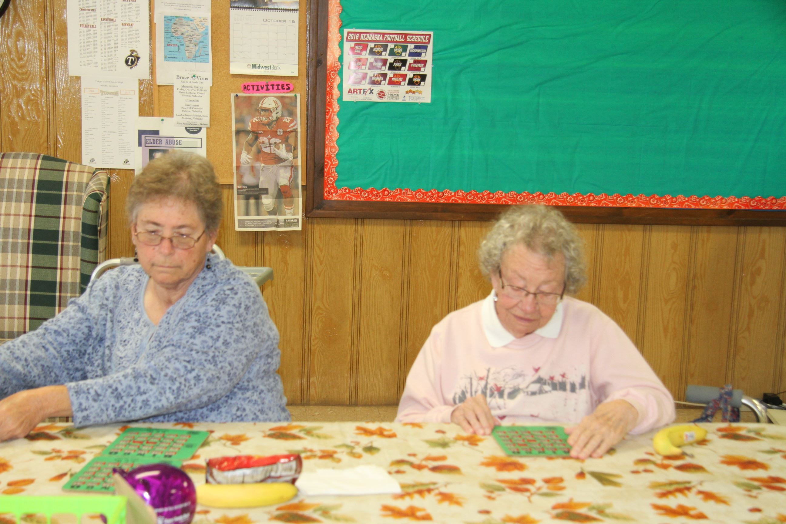 Women Sitting at Table Playing Bingo