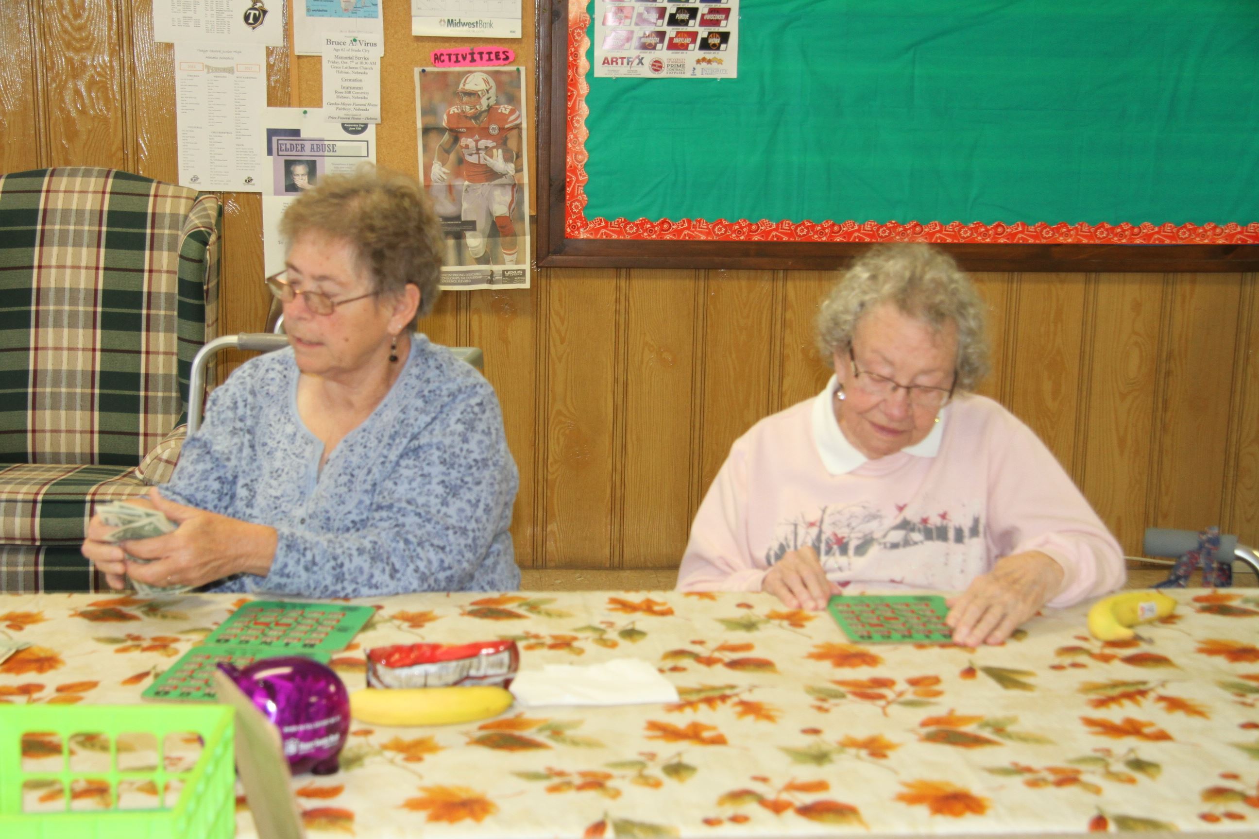 Women Sitting at Table Playing Bingo