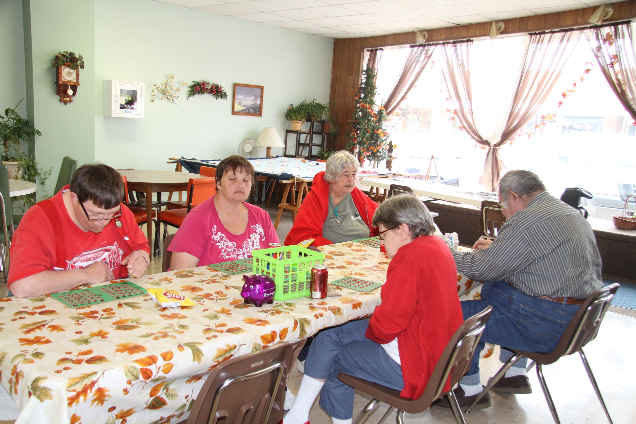 People Sitting at Table in Senior Center